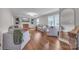 Inviting living room with hardwood floors, neutral decor and brick fireplace at 827 River Hills Ct, Taylorsville, NC 28681