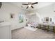 Cozy bedroom featuring a bed with a makeup vanity and neutral decor at 9530 Hightower Oak St, Huntersville, NC 28078