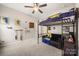 Bedroom with carpet floors, a ceiling fan and black metal bunk beds at 9530 Hightower Oak St, Huntersville, NC 28078