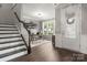 Bright home office with a large window, a wooden desk, a comfortable chair, and stylish decor at 9530 Hightower Oak St, Huntersville, NC 28078