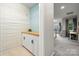 A hallway view to a laundry room with butcher block countertop and built in cabinets at 9530 Hightower Oak St, Huntersville, NC 28078