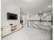 Open loft area featuring a tv, entertainment console, and a staircase at 9530 Hightower Oak St, Huntersville, NC 28078