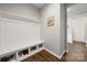 A mudroom area features hooks, a bench and storage cubbies, perfect for organization at 9530 Hightower Oak St, Huntersville, NC 28078