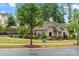 Exterior view of the pool house next to the pool area with a lush green landscape at 9530 Hightower Oak St, Huntersville, NC 28078