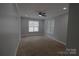 Bright bedroom featuring neutral walls, plush carpeting, crown molding, recessed lighting, and large windows at 1000 E Woodlawn Rd # 107, Charlotte, NC 28209