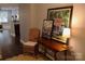 A welcoming entryway showcasing decor, hardwood floors, and a glimpse into the living area at 1000 E Woodlawn Rd # 107, Charlotte, NC 28209