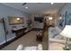 Open-concept living room with hardwood floors, neutral paint, and elegant decor at 1000 E Woodlawn Rd # 107, Charlotte, NC 28209