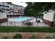 Community pool featuring an in-ground pool with seating at 1000 E Woodlawn Rd # 107, Charlotte, NC 28209