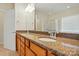Bathroom features double sink vanity with granite countertops and a framed mirror, plus a walk-in glass shower at 1030 Pinehurst Ln, Fort Mill, SC 29707