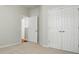 Neutral bedroom with carpet, bright white trim, and closet at 1030 Pinehurst Ln, Fort Mill, SC 29707