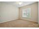 This bedroom features a window with blinds and neutral colored carpet at 1030 Pinehurst Ln, Fort Mill, SC 29707