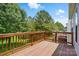 Private wooden deck with railing, offering scenic views of the surrounding trees and neighborhood at 1030 Pinehurst Ln, Fort Mill, SC 29707