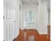 Bright foyer with wood floors, white trim, and a glimpse into the rest of the home at 1030 Pinehurst Ln, Fort Mill, SC 29707