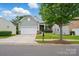 Traditional home featuring gray siding, a white garage door, and a well-manicured lawn with a mailbox at 1030 Pinehurst Ln, Fort Mill, SC 29707