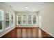 Bright sunroom with large windows and wood floors at 1030 Pinehurst Ln, Fort Mill, SC 29707