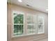 Three windows offer a scenic view of the outdoors, bringing ample natural light into the room at 1030 Pinehurst Ln, Fort Mill, SC 29707