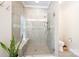 A tiled bathroom features a glass shower with built-in bench seating at 106 Hannaford Pl # 15, Gastonia, NC 28052