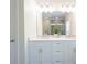 Modern bathroom features double vanity with white countertops and large mirror reflecting glass shower at 106 Hannaford Pl # 15, Gastonia, NC 28052