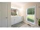 Bathroom with double sink vanity, and a large window letting in natural light at 106 Hannaford Pl # 15, Gastonia, NC 28052