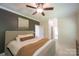 Bright bedroom with an earth tone accent wall, natural light, and crown molding details at 106 Hannaford Pl # 15, Gastonia, NC 28052