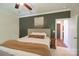 Cozy bedroom featuring a neutral color scheme, crown molding, and an ensuite bathroom entrance at 106 Hannaford Pl # 15, Gastonia, NC 28052