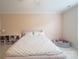 Bedroom featuring a pink wall, a white patterned bed, and a ball pit at 106 Hannaford Pl # 15, Gastonia, NC 28052