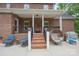 Home's covered brick patio includes a seating area at 106 Hannaford Pl # 15, Gastonia, NC 28052
