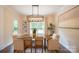 Elegant dining room with a modern chandelier and large windows at 106 Hannaford Pl # 15, Gastonia, NC 28052