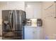 Close-up of kitchen features stainless steel refrigerator and an espresso machine at 106 Hannaford Pl # 15, Gastonia, NC 28052