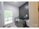 Functional laundry room with modern washer and dryer units and natural light at 106 Hannaford Pl # 15, Gastonia, NC 28052