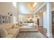 Open-concept living room with a view of the second story and access to the kitchen at 106 Hannaford Pl # 15, Gastonia, NC 28052