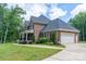 This brick home includes an attached garage, and walkway to the covered front porch at 106 Hannaford Pl # 15, Gastonia, NC 28052