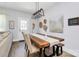 Dining area featuring modern lighting fixture, wood table and chairs, and access to back entrance at 1066 Mclain Rd # 14, Kannapolis, NC 28083