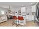 Modern kitchen boasts a center island with breakfast bar, white cabinetry, and stylish backsplash at 1066 Mclain Rd # 14, Kannapolis, NC 28083