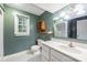 Bathroom featuring modern fixtures, ample counter space, and natural light at 1120 N College St, Mount Pleasant, NC 28124