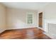 Cozy bedroom with natural light and classic hardwood floors at 1120 N College St, Mount Pleasant, NC 28124