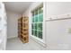 Bright closet space featuring built-in shelving and natural light from a window at 1120 N College St, Mount Pleasant, NC 28124