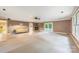 Expansive living room featuring a fireplace, hardwood floors, and a large window for ample natural light at 1120 N College St, Mount Pleasant, NC 28124