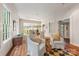 Spacious living area with wooden floors, a dining room, bright, sunny, and perfect for gatherings at 1120 N College St, Mount Pleasant, NC 28124