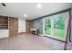 Versatile room with tile floors, double doors, and a brick wall at 1120 N College St, Mount Pleasant, NC 28124