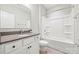 Clean bathroom featuring a bathtub and a mirror above the sink at 1162 E 36Th St, Charlotte, NC 28205