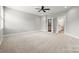 Bright and spacious bedroom, featuring plush carpet and an open doorway to the ensuite bathroom at 1162 E 36Th St, Charlotte, NC 28205