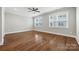 Spacious bedroom featuring hardwood floors, a ceiling fan, and natural light from two large windows at 1162 E 36Th St, Charlotte, NC 28205