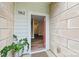 Inviting entrance with red door, view of foyer with stairs, and tile flooring at 1162 E 36Th St, Charlotte, NC 28205