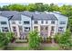 Exterior view of townhomes featuring modern design, small balconies, and landscaping at 1162 E 36Th St, Charlotte, NC 28205