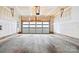 Spacious two-car garage with concrete floor and functional garage door at 1162 E 36Th St, Charlotte, NC 28205