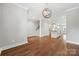 Open-concept living space showcasing hardwood floors and easy access to the modern kitchen with a center island at 1162 E 36Th St, Charlotte, NC 28205
