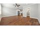 Hardwood floors connect living room and kitchen space at 1162 E 36Th St, Charlotte, NC 28205