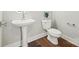 Charming powder room featuring a pedestal sink, modern toilet, and stylish fixtures at 1162 E 36Th St, Charlotte, NC 28205