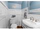 Stylish half bathroom featuring blue walls, white trim and a classic sink at 129 Alder Springs Ln, Mooresville, NC 28117